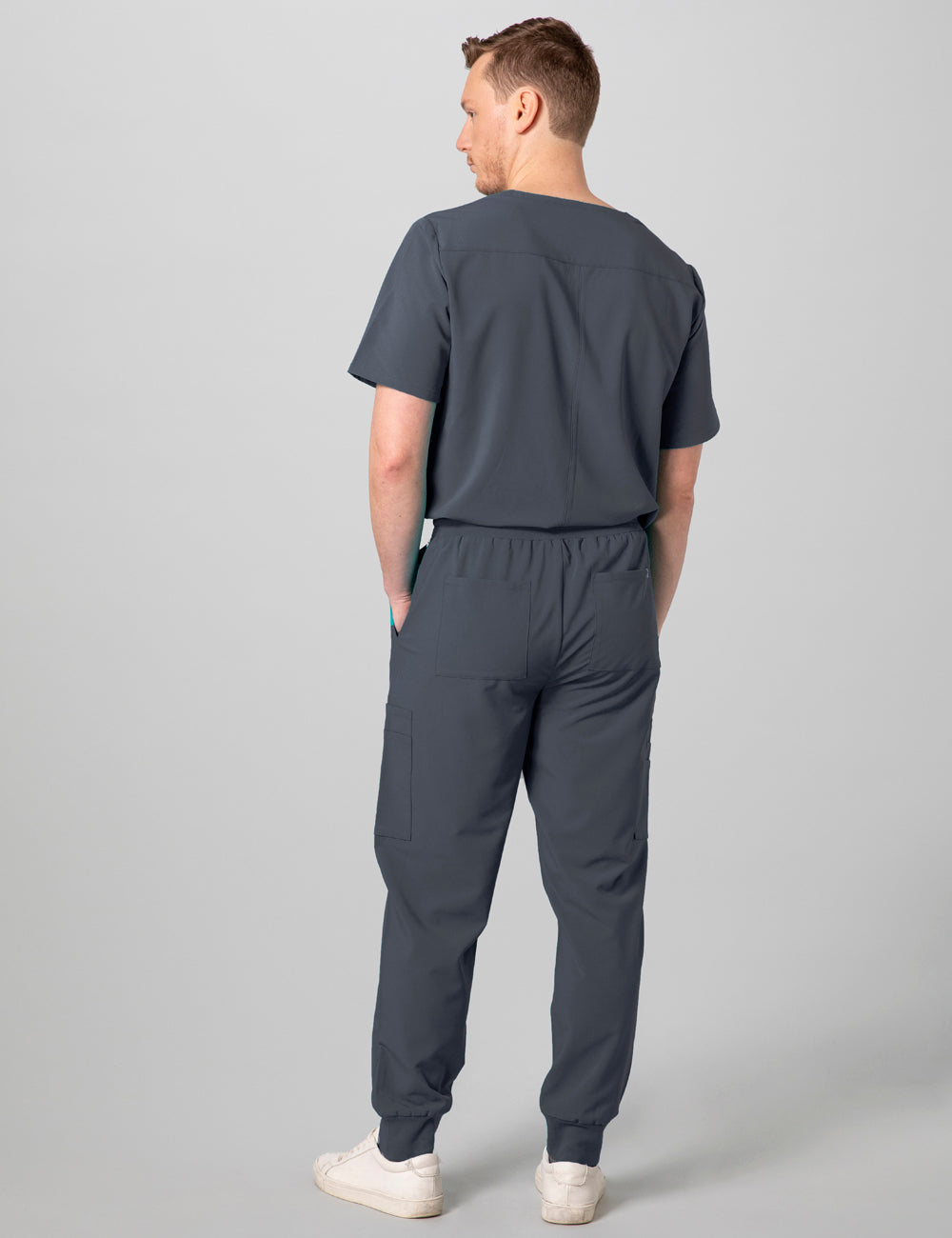 Stylish and functional men&#39;s scrub top in pewter, offering a sleek fit and practical pocket design