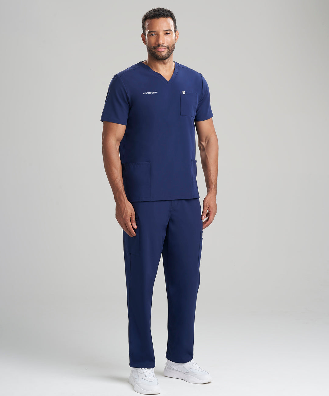 Men's 3-pocket V-neck scrub top in navy, combining a professional look with practical storage options