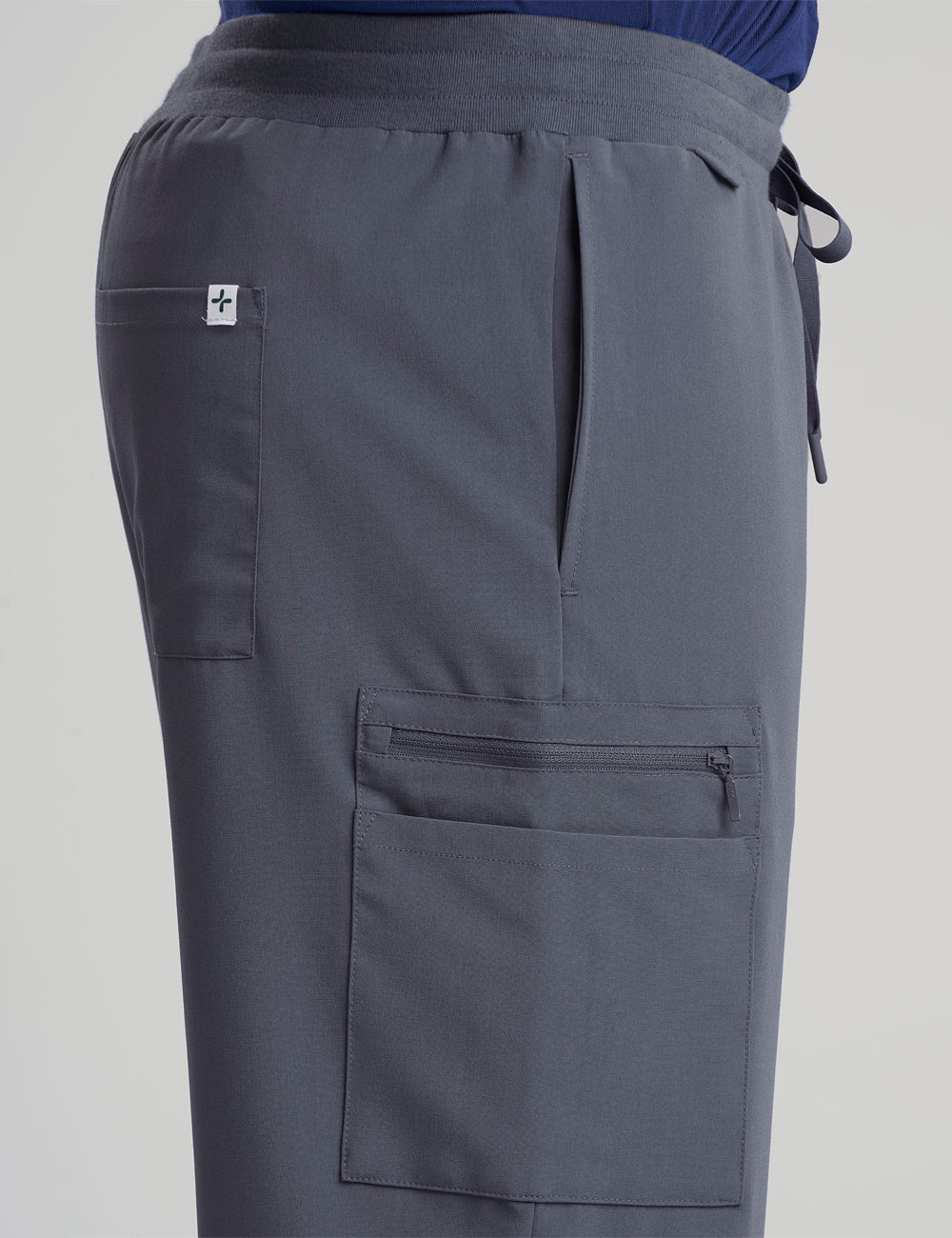 Pewter men's scrub pants with seven pockets, offering a modern fit and plenty of storage