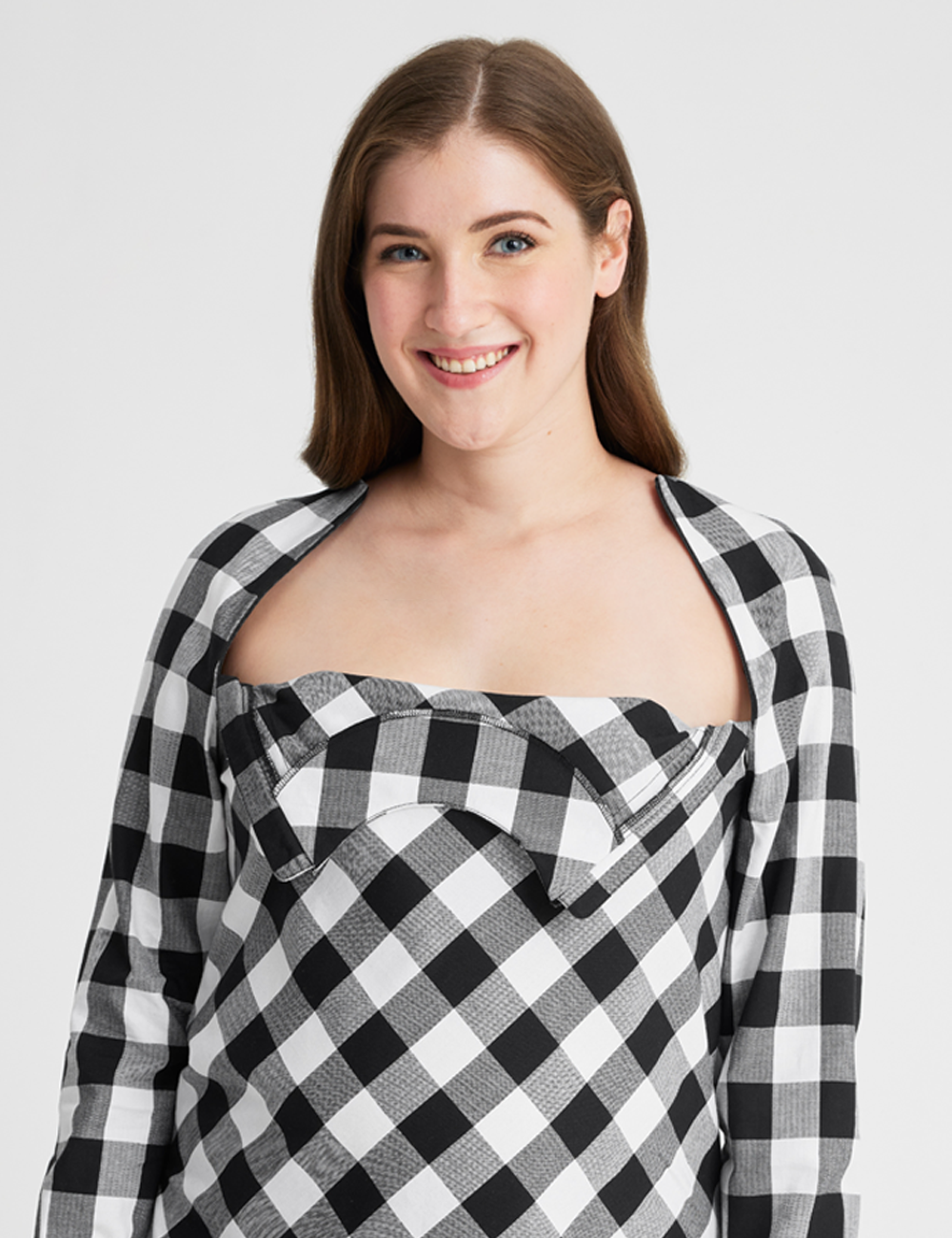 Chest port access blouse in black and white plaid, combining style with convenient medical functionality.