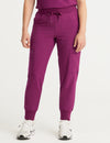 Women's jogger scrub pants in burgundy, offering stylish comfort and functional storage for healthcare professionals