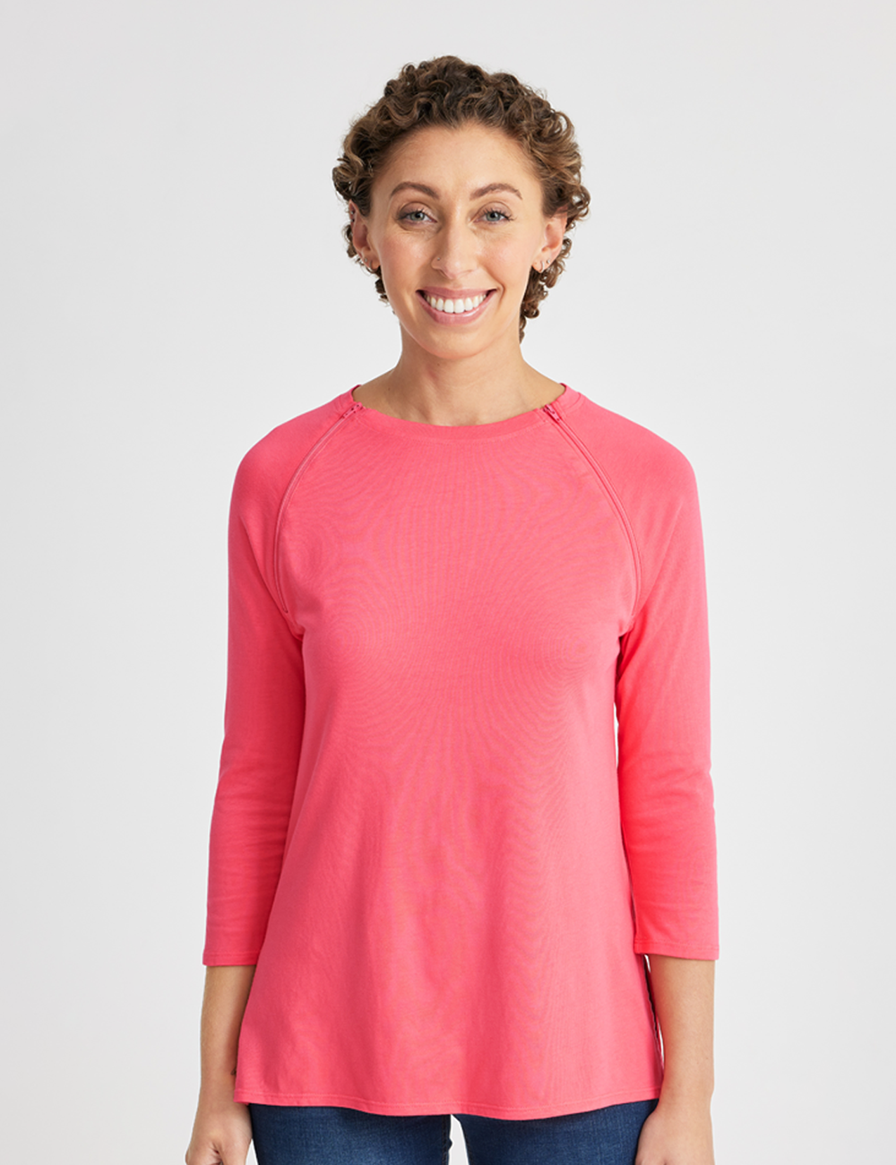Women&#39;s chest port access shirt in coral, offering a vibrant and comfortable design for healthcare needs