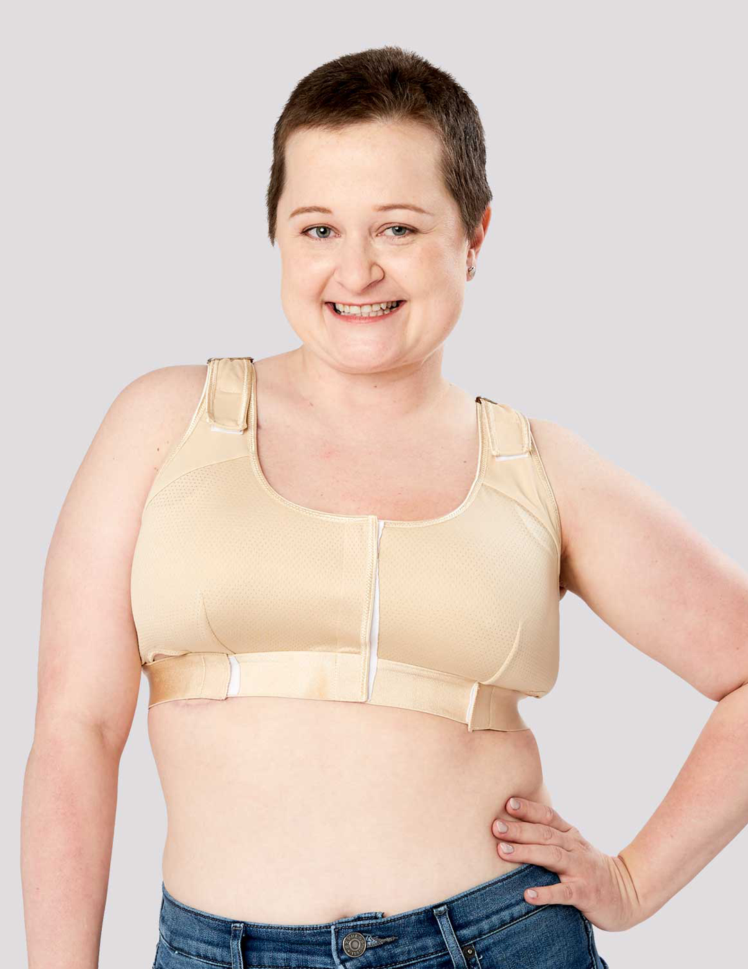 The Believer Bra in chocolate provides rich-toned, supportive comfort for post-mastectomy recovery, combining durability with style. Model is wearing size Large