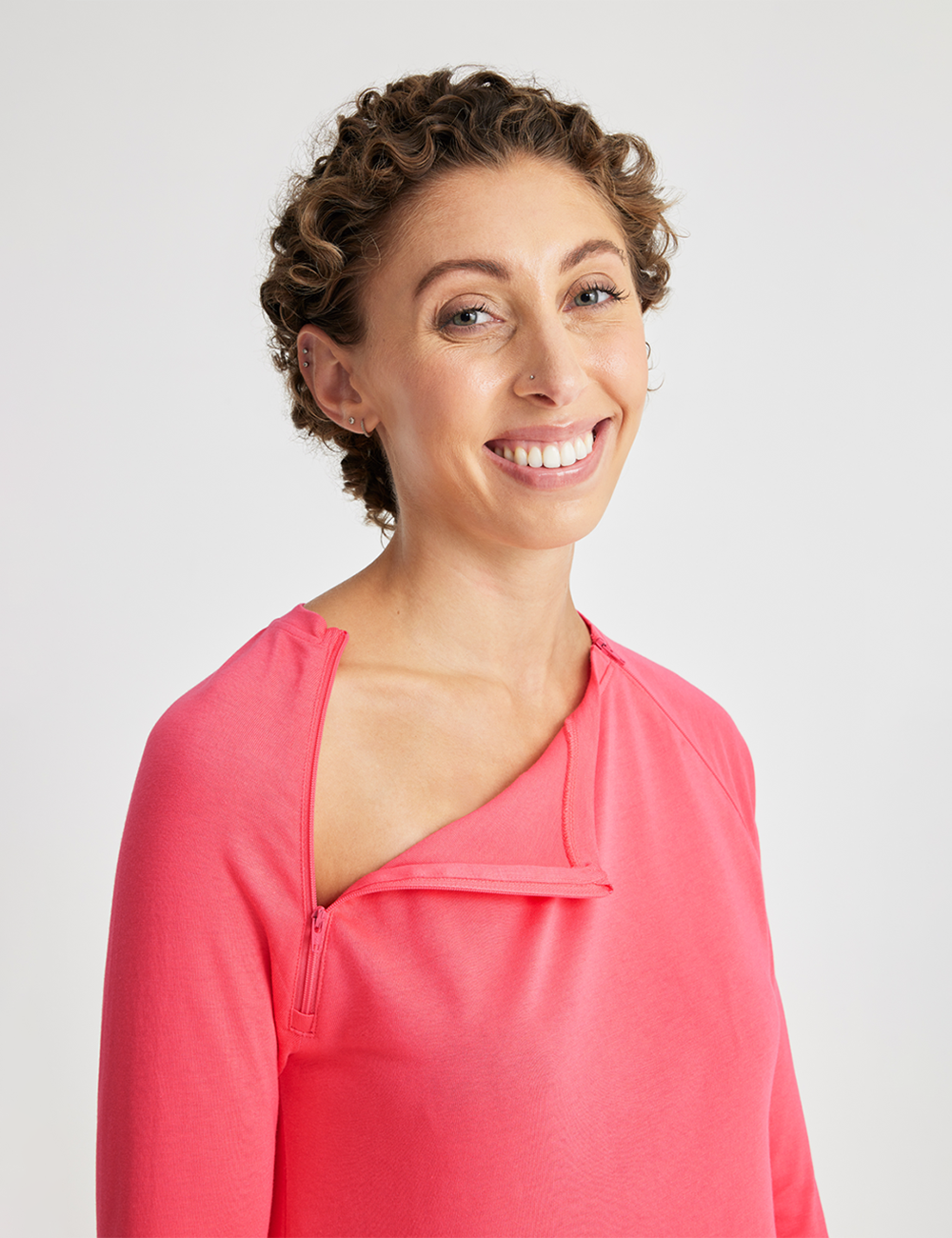 Stylish plum-colored Women&#39;s Chest Port Access Shirt from Care+Wear, combining fashion with utility.