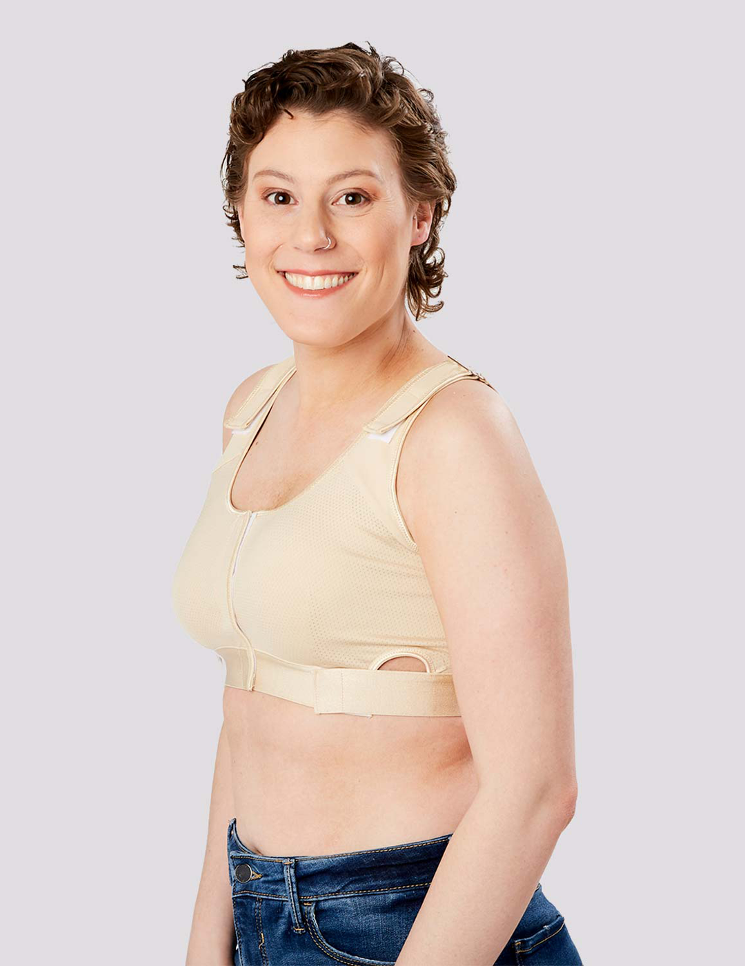 Bold leopard The Believer Bra, offering secure post-surgical support with a trendy pattern that adds flair to recovery wear. Model is wearing size Medium