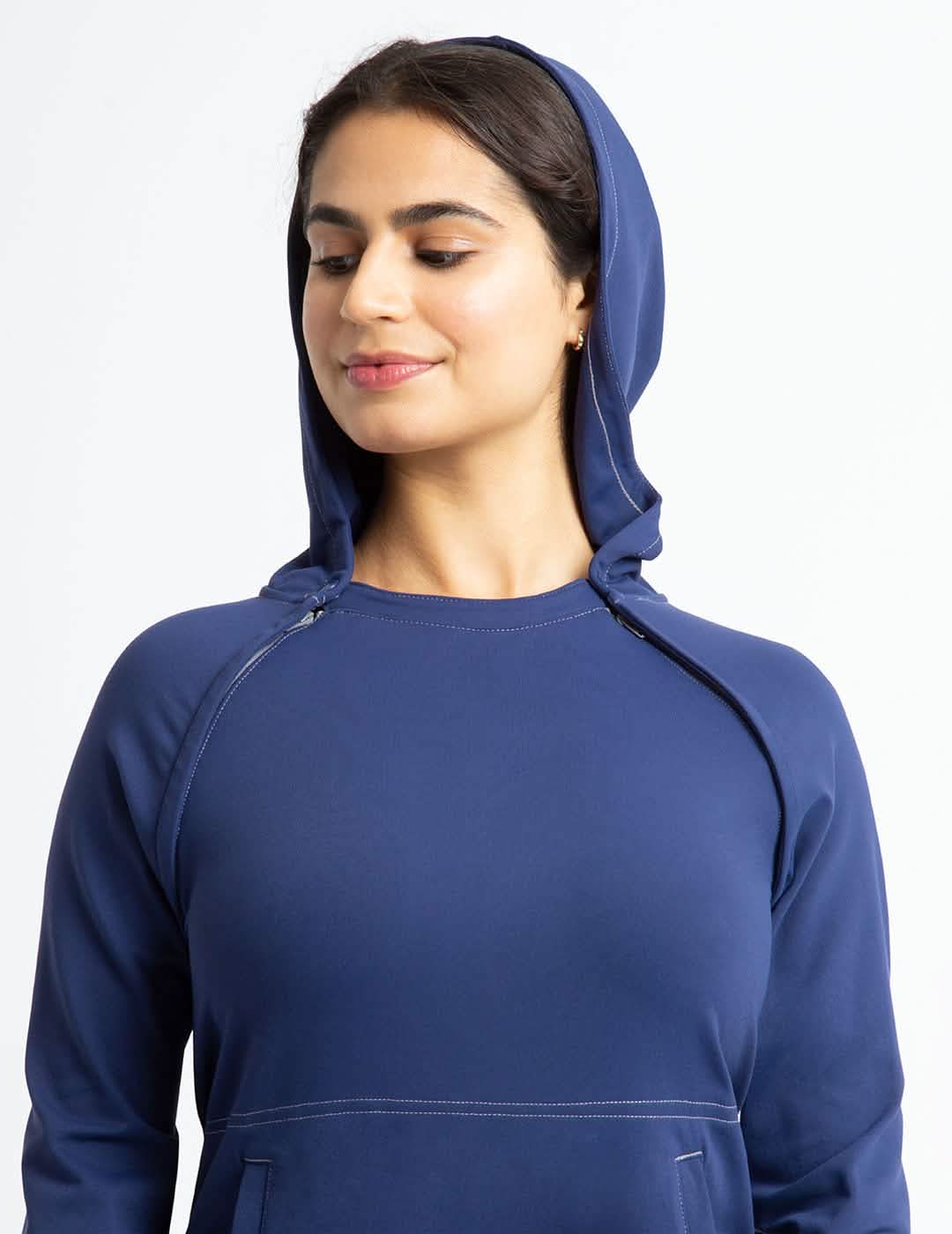 Red women&#39;s chest port access hoodie by Oscar de la Renta, offering a bold look with practical medical features.