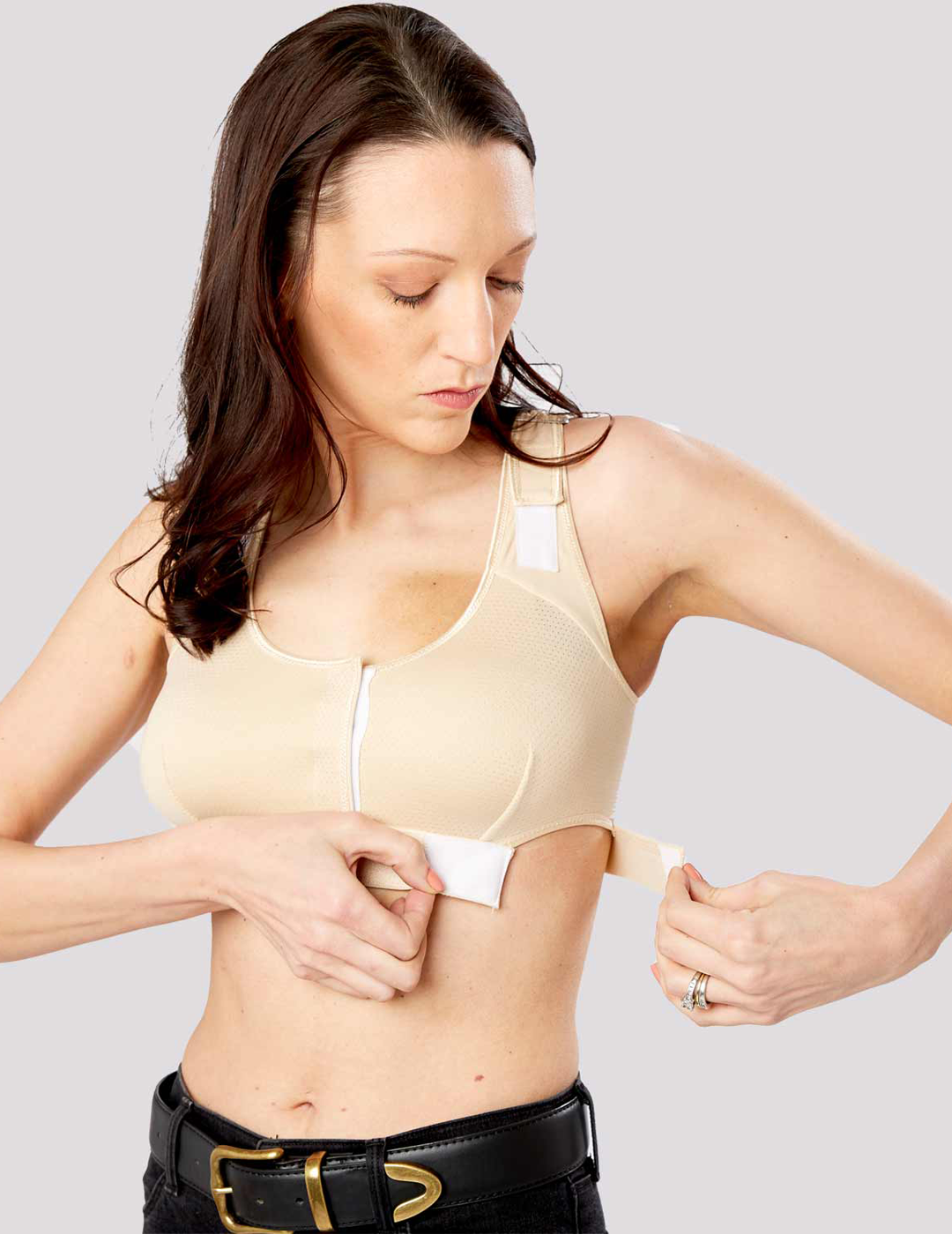 The Believer Bra in Cassia offers supportive post-mastectomy comfort with a soft, warm hue, ideal for sensitive skin. Model is wearing size Small