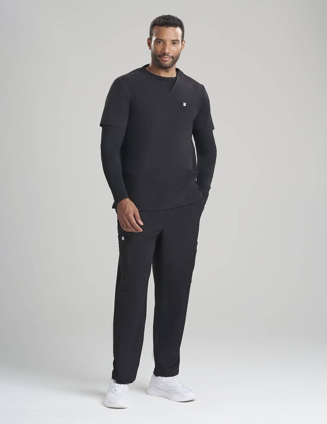 Gray men&#39;s underscrub shirt with long sleeves, designed for breathability and everyday use.