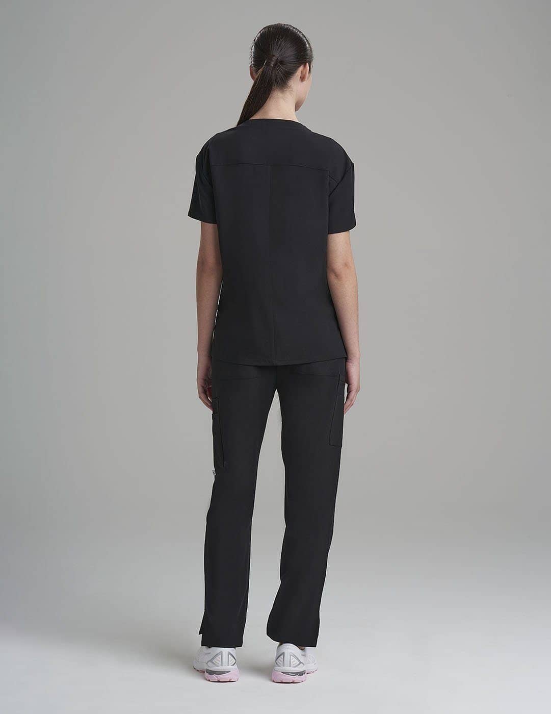 Stone gray women&#39;s scrub top with a V-neck and three pockets, providing efficiency and style.