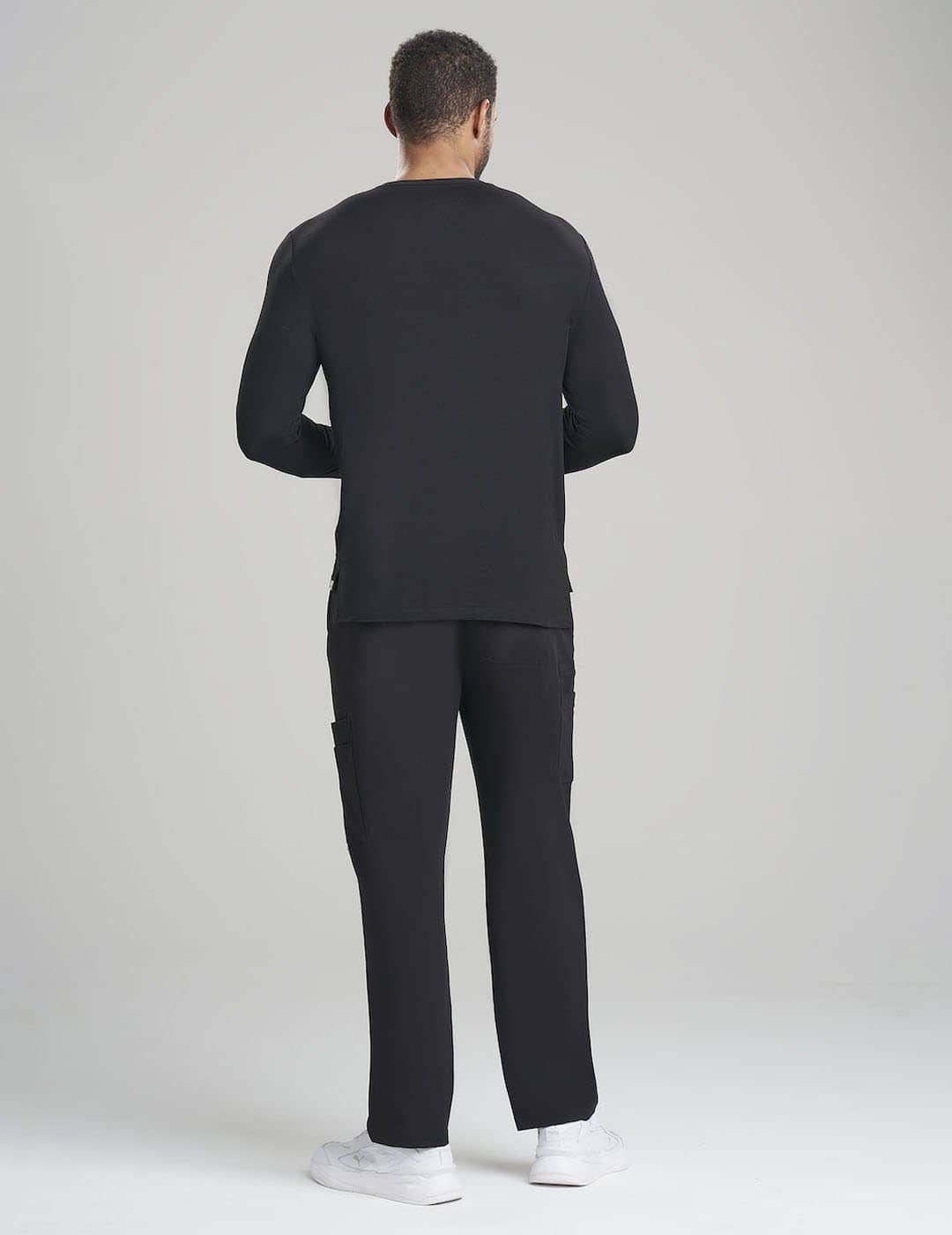 Men&#39;s long sleeve underscrub shirt in gray, offering a comfortable fit for layering under scrubs.