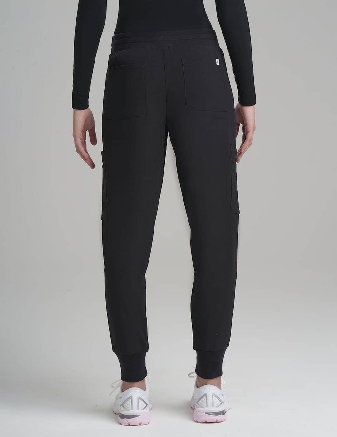 Comfortable hunter green scrub jogger pants for women, ideal for long shifts with ample pockets.