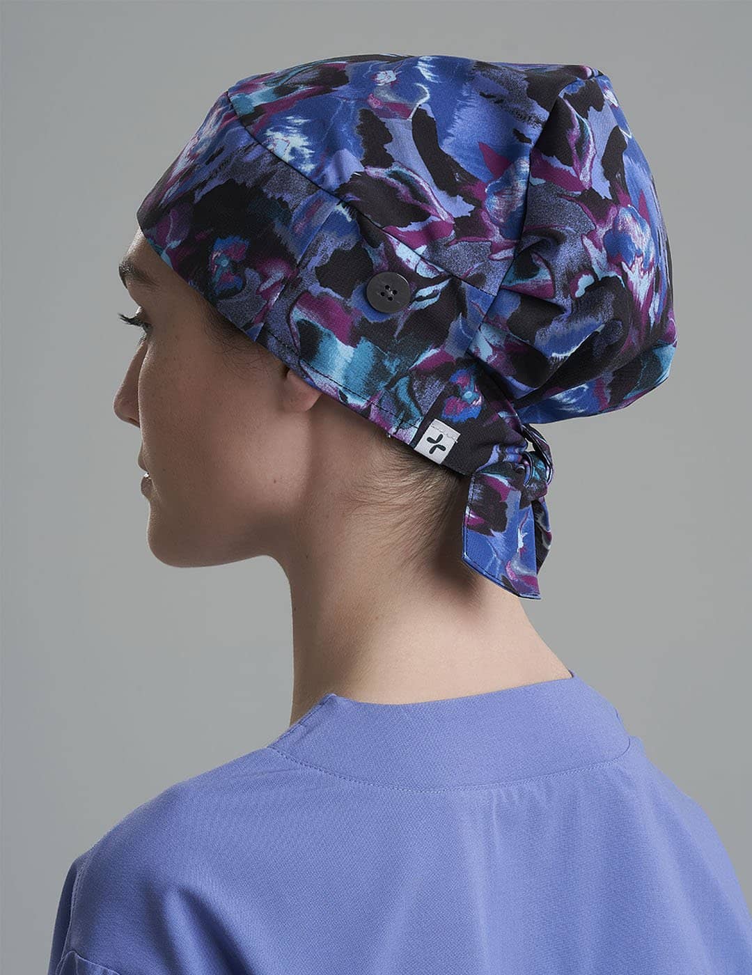 Women&#39;s surgical scrub cap in Blue Leopard, featuring a unique blue leopard pattern for a fashionable yet professional appearance.