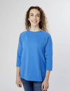 Women's chest port access shirt in nebulas blue, combining bold color with practicality for medical wear
