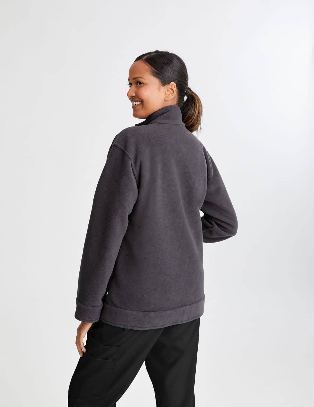 Durable women&#39;s reversible fleece jacket in black and gray, blending style with practicality for healthcare settings.