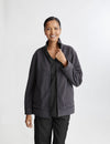 Women's reversible fleece jacket in black and gray, designed for dual-color versatility and warmth for healthcare professionals