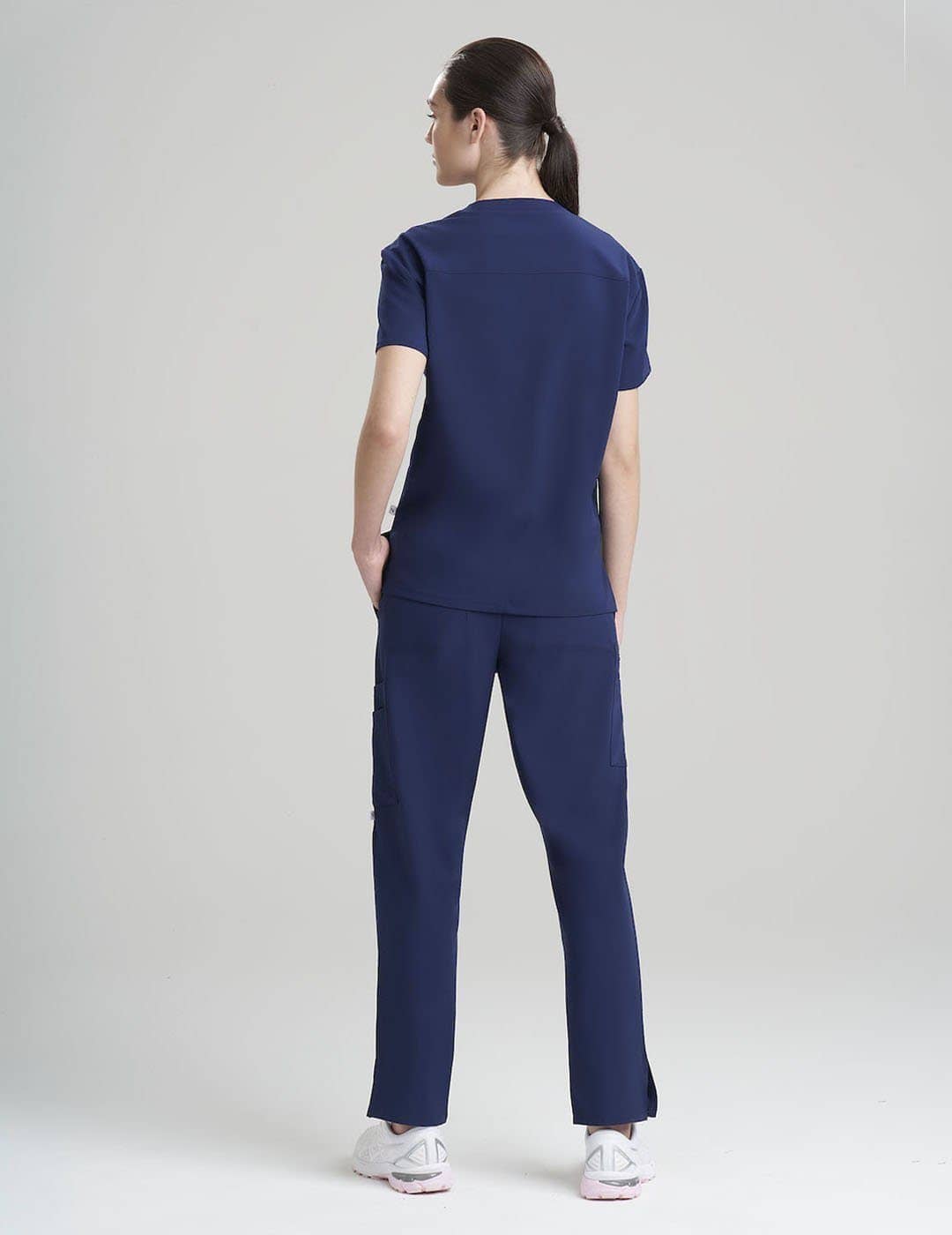 Stone gray V-neck scrub top for women, blending a timeless color with three practical pockets.
