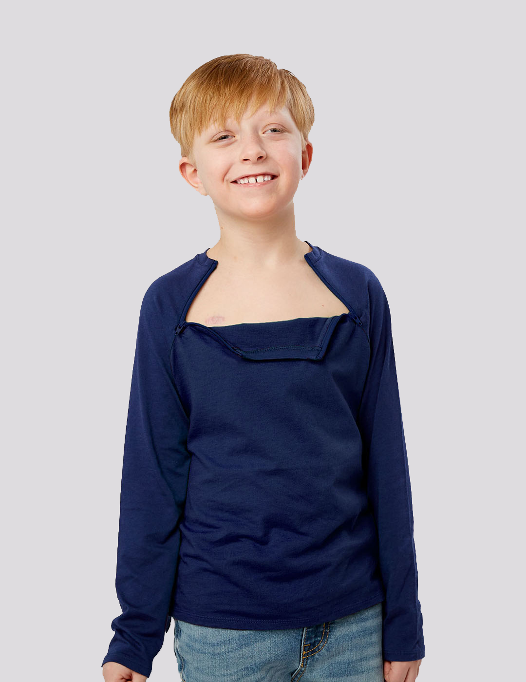 Care+Wear Kids Chest Port Access Shirt in navy, designed for comfort and practicality for young patients. Model is wearing size Medium