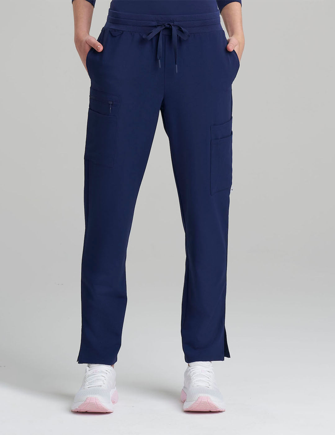 Women's 9-pocket straight leg scrub pants in stone gray, combining functionality and modern style.