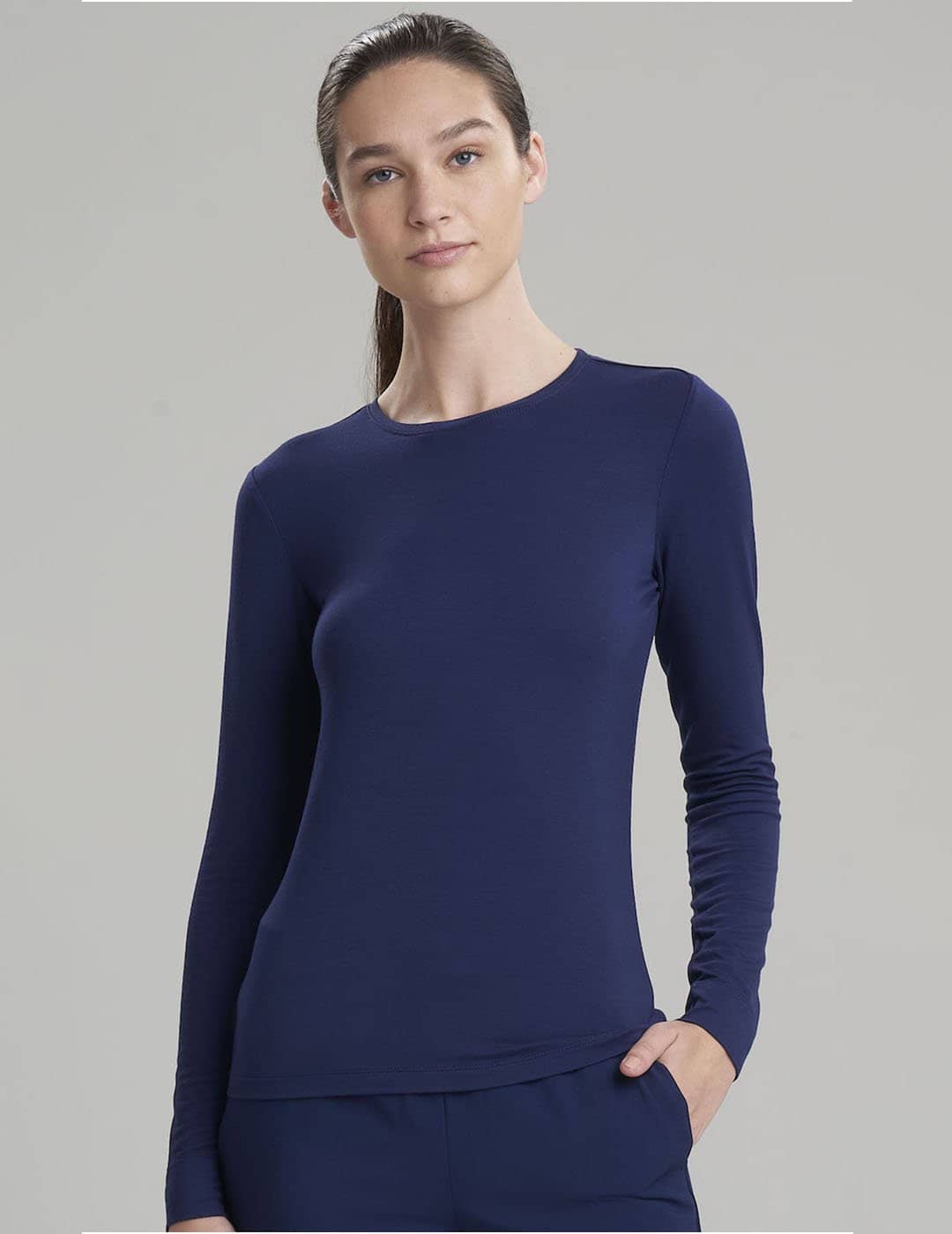Women&#39;s long sleeve underscrub shirt in navy, crafted for warmth and professional layering in healthcare settings
