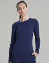 Women's long sleeve underscrub shirt in navy, crafted for warmth and professional layering in healthcare environments