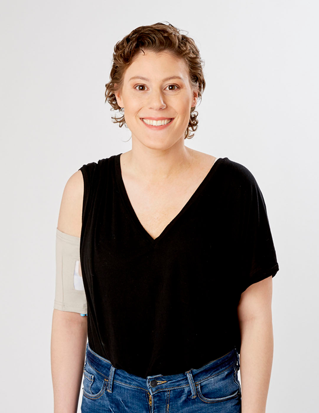Violet-colored PICC line cover featuring ultra grip technology for a snug and reliable fit. Model is wearing size 11&quot;-13&quot; Bicep