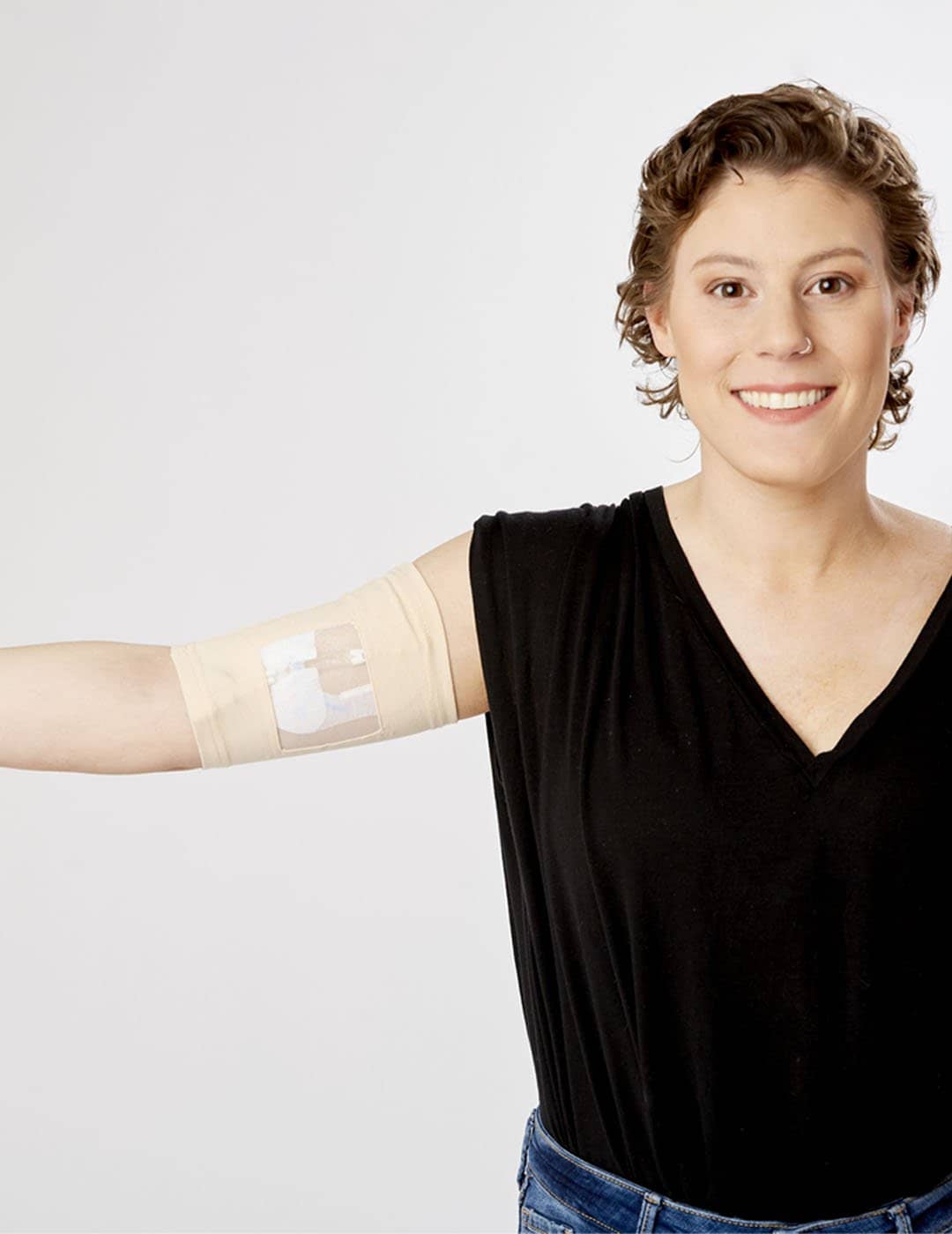 Care+Wear Classic PICC Line Cover in dawn hue, offering a soft, calming color with advanced antimicrobial protection. Model is wearing size 11&quot;-13&quot; Bicep