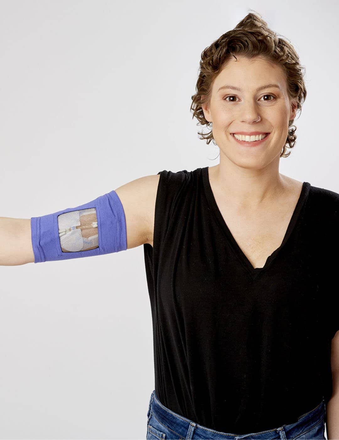 Premium violet-colored PICC Line Cover from Care+Wear, providing durable protection and a striking look. Model is wearing size 11&quot;-13&quot; Bicep