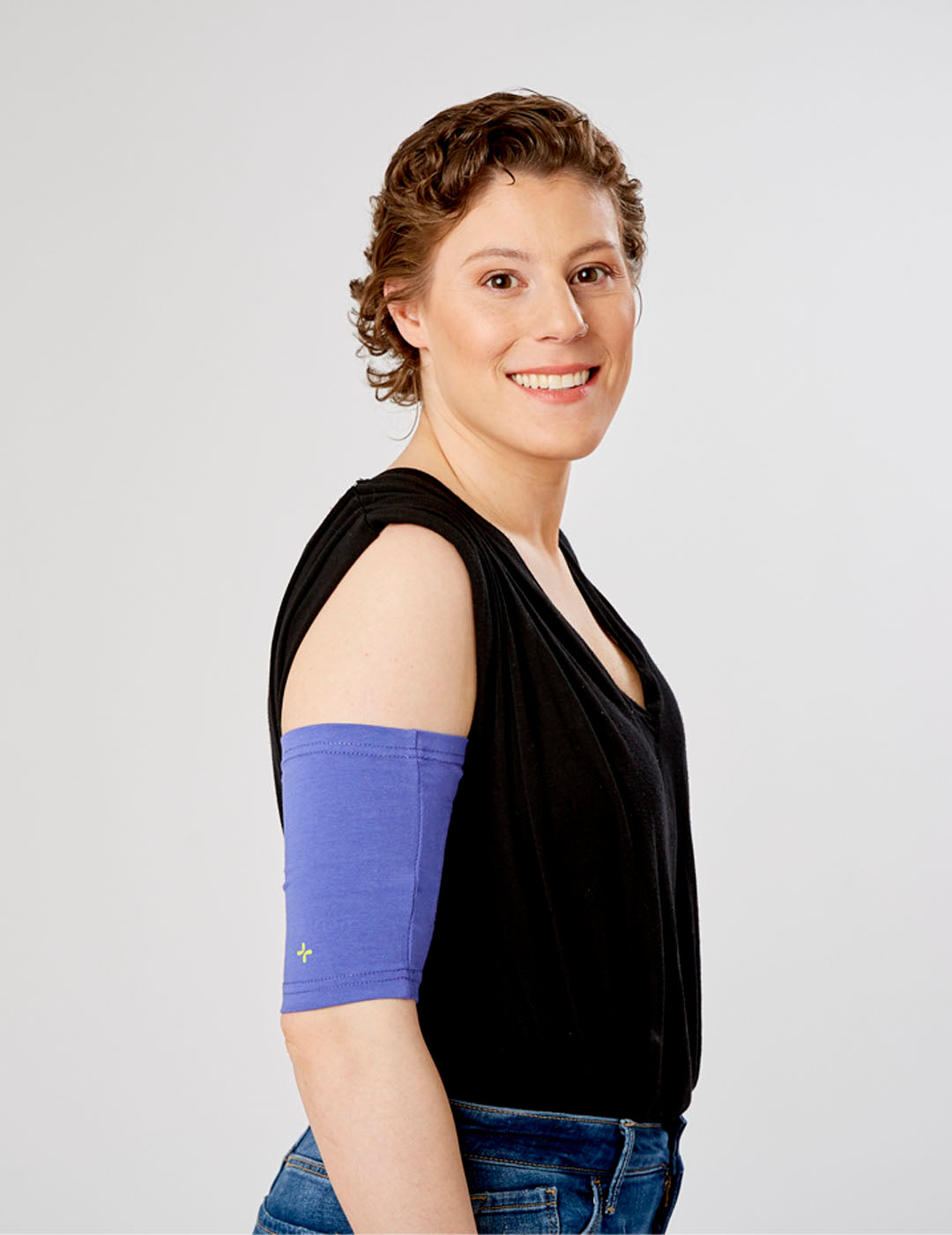 Slate-colored PICC line cover with ultra grip technology, designed for reliable and comfortable protection. Model is wearing size 11&quot;-13&quot; Bicep