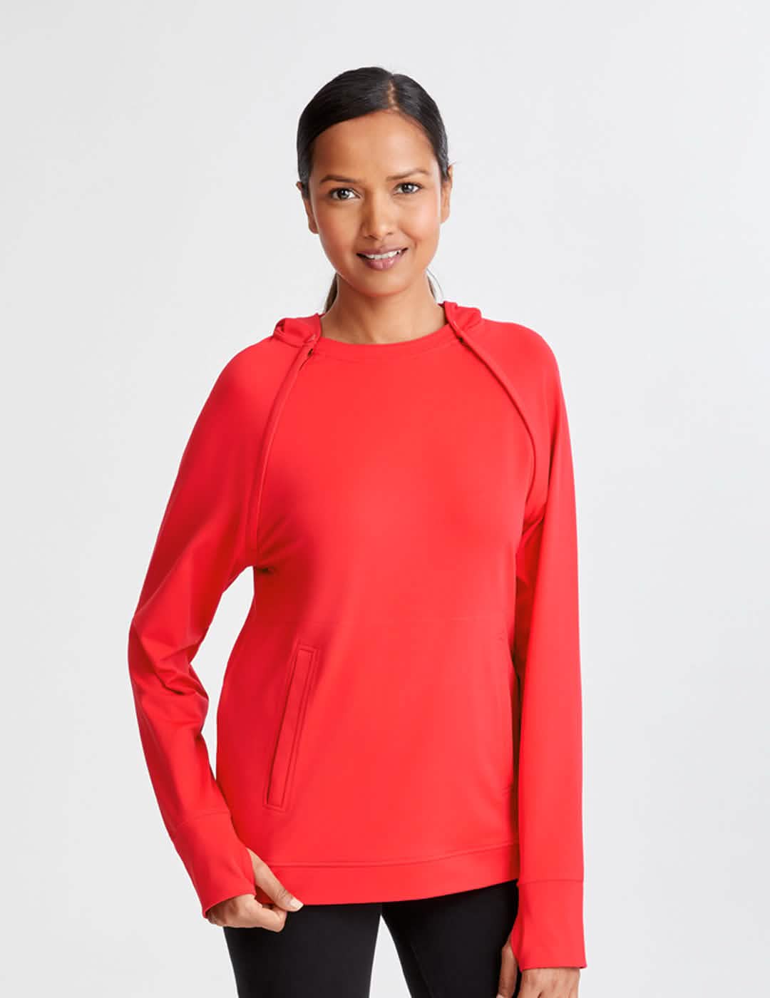 Model is wearing size Small for a looser fit | Luxurious pink chest port access hoodie for women, designed by Oscar de la Renta for comfort and style.|