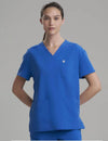 Women's V-neck scrub top in royal blue, combining bold style with comfort and utility for healthcare settings