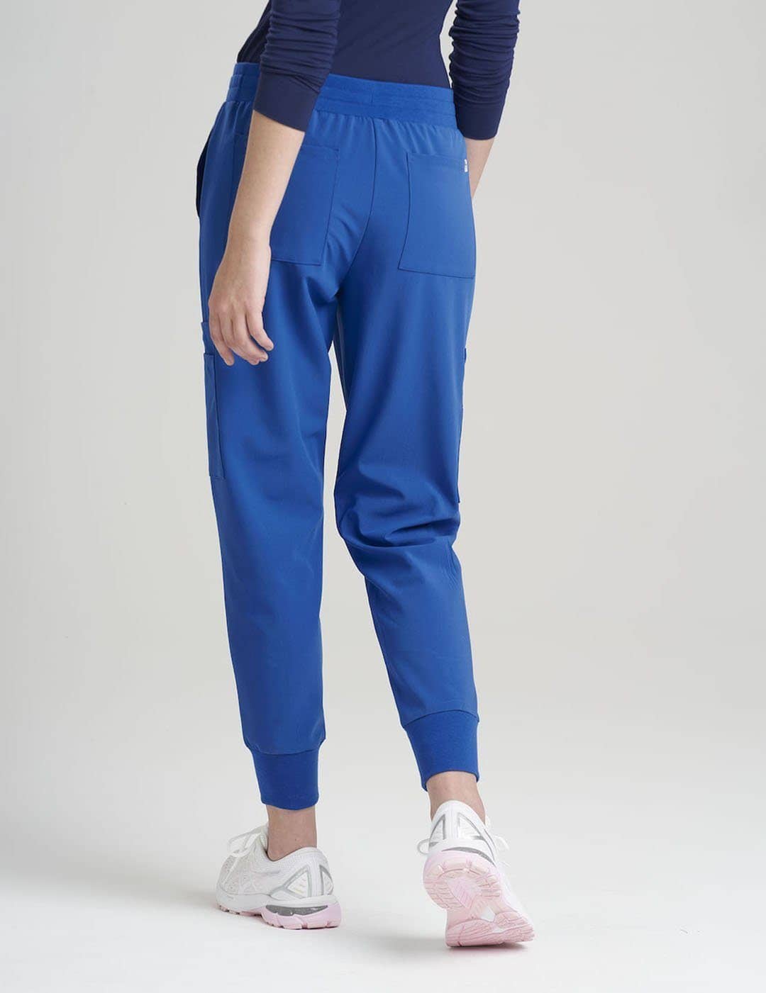 Versatile stone gray scrub jogger pants for women, blending style with extensive storage.
