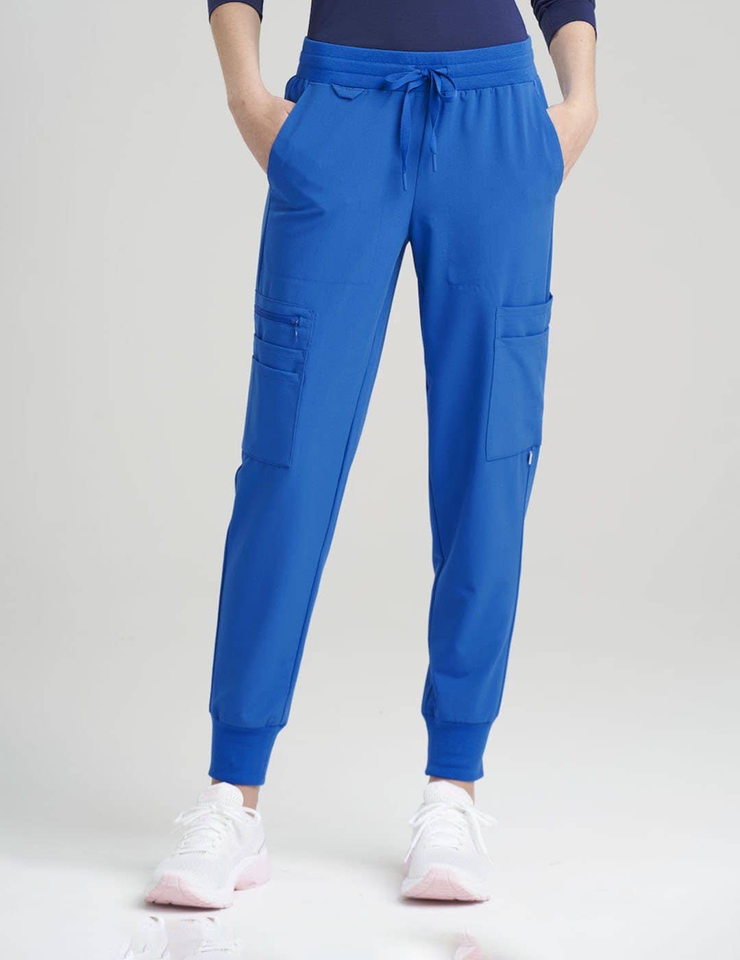 Women&#39;s jogger scrub pants in royal blue, combining bold color with practical comfort and utility