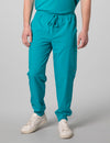 Men's jogger scrub pants in teal, combining vibrant color with comfort and functionality for medical use