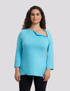 Women's chest port access shirt in teal, providing a modern and practical option for medical support